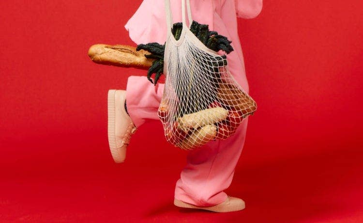 money saving tips person running with groceries