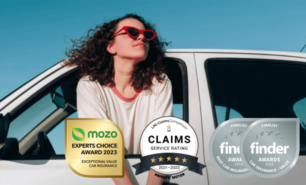 Young woman looking at three different car insurance awards