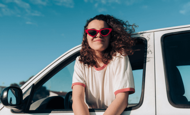 Woman on road trip happy with her car insurance