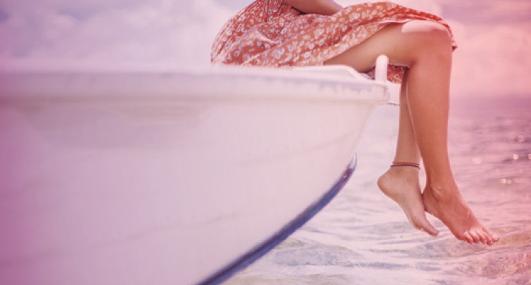 Feet dangling off the boat